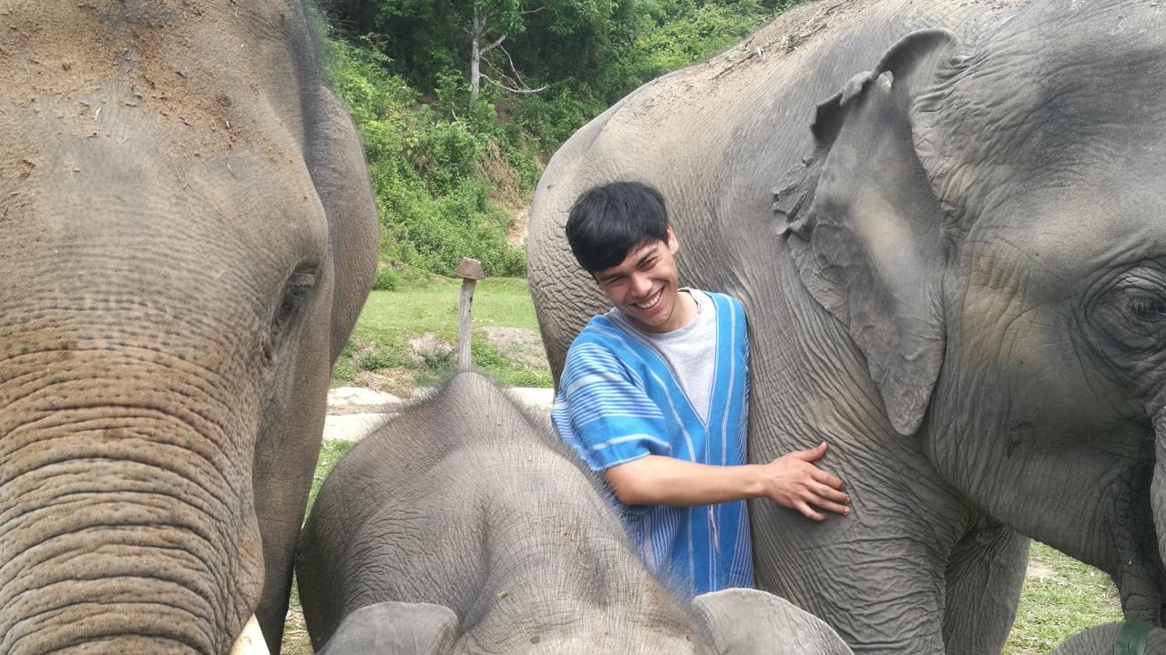 student with elephant