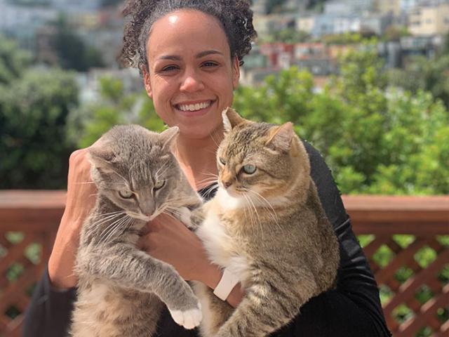 Ruth Goins at home with her cats, Galaxy (left) and Honey. Courtesy photo.