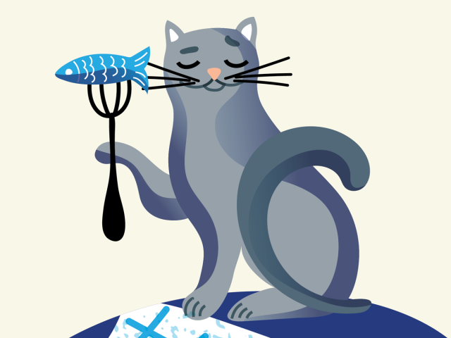 kitty on a table with a fish on a fork